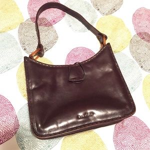 Dark brown leather purse by Cole Haan